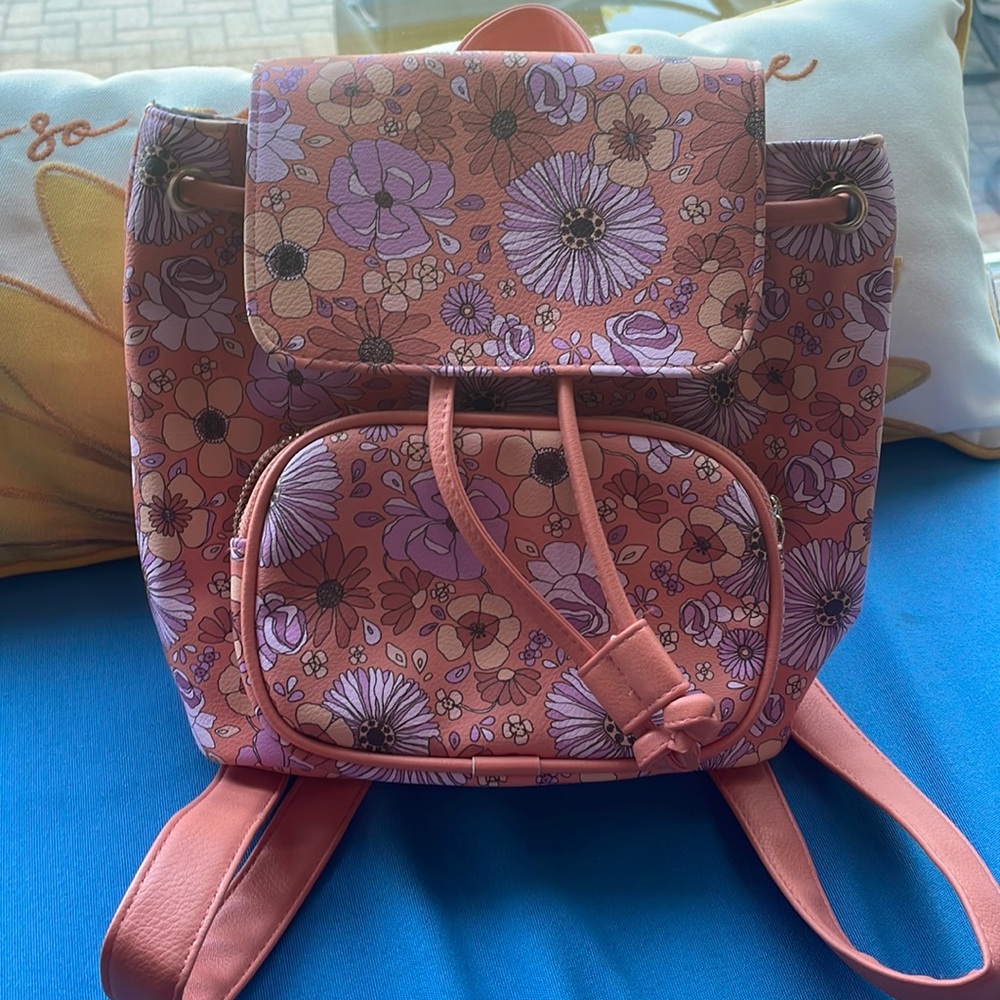 A small floral orange backpack.